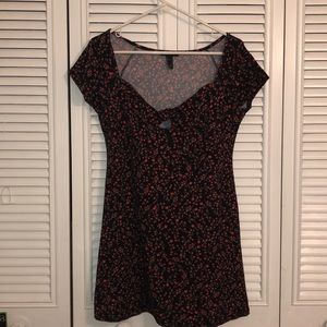 Selling a black dress with red flower detail
